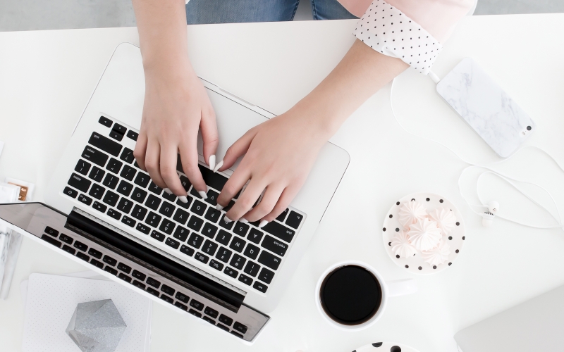 La Mode College student doing assignment on laptop